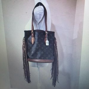 Authentic Louis Vuitton bucket bag with fringe!